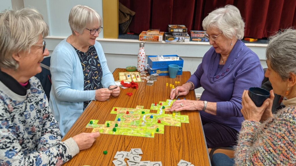 u3a members playing Carcassonne board game