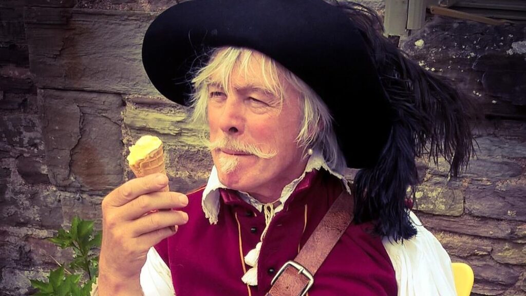 Sealed Knot cavalier reenactor enjoying an ice cream